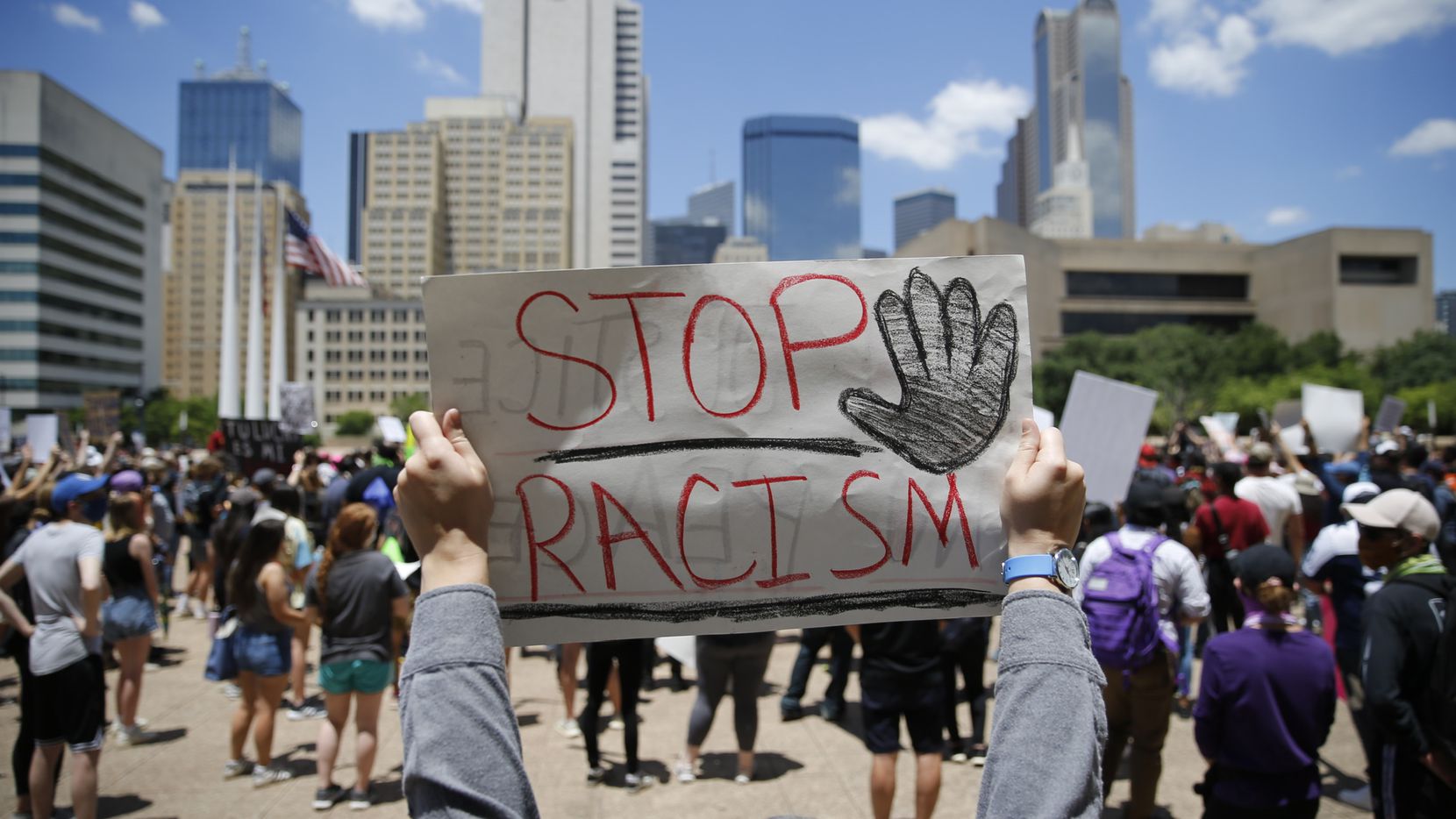 Demonstrators gathered in downtown Dallas on Saturday to rally against police brutality.