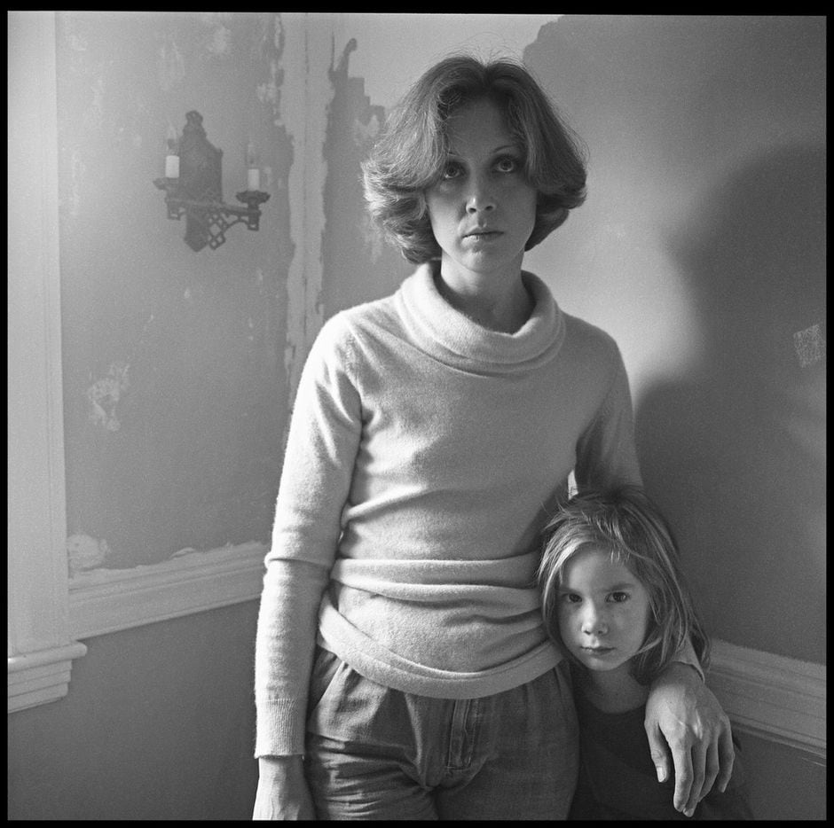 Black-and-white photos by Paul Black of his wife, Carol. Now, for the first time, his decades of photographs of Carol documenting their lives together is the subject of a new exhibition at Barry Whistler Gallery. This one shows Carol with the couple's daughter, Cassandra. 