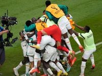 Senegal players celebrate after teammate Kalidou Koulibaly scored their side's second goal...