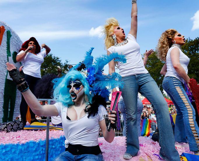 Revelers on a float perform for the crowd during the Alan Ross Texas Freedom Parade.