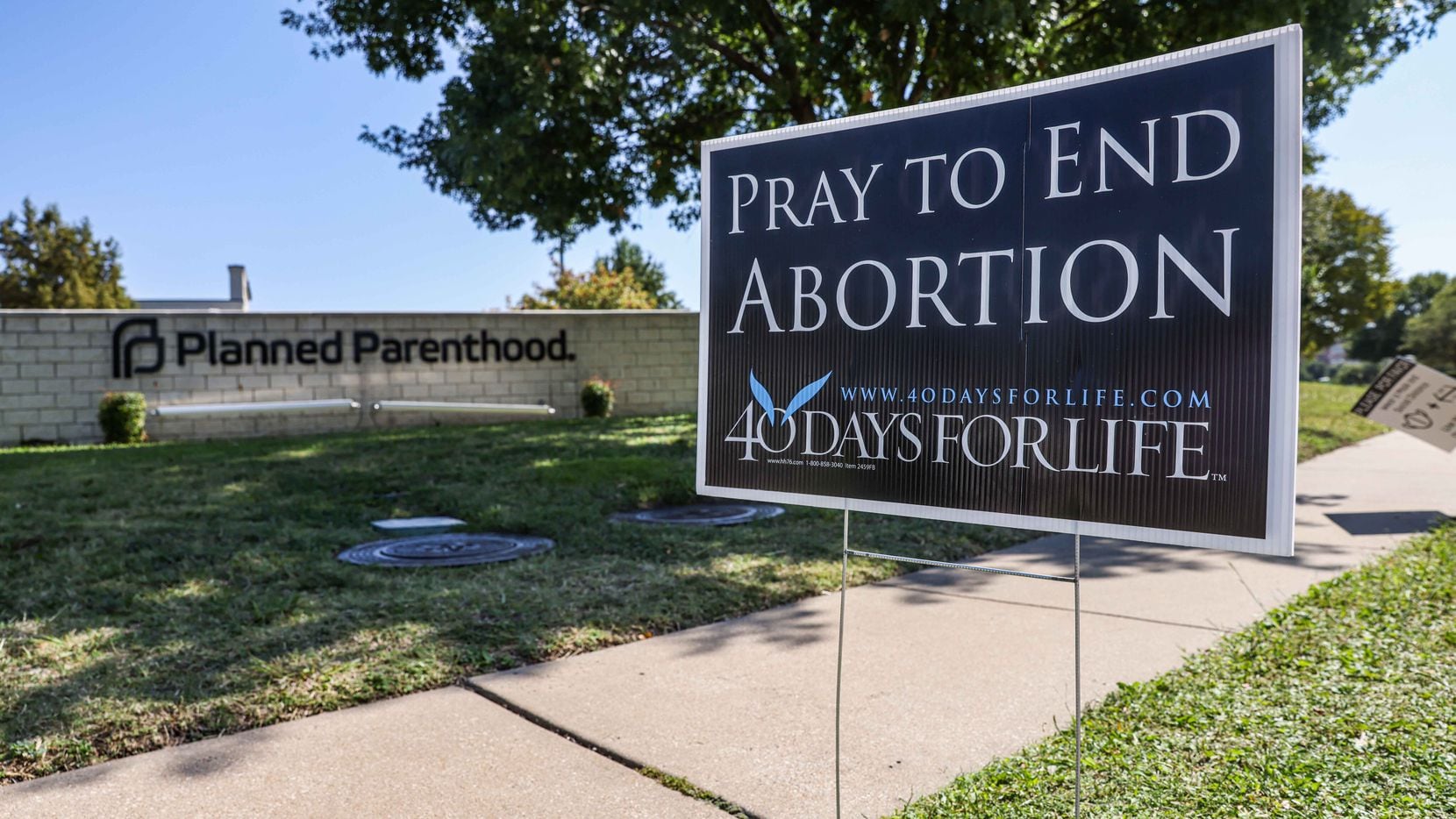 A anti-abortion sign stands on the sidewalk near Planned Parenthood in Dallas on Thursday,...