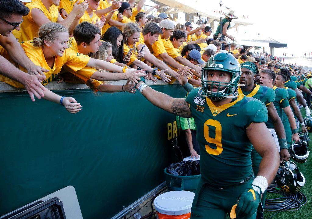 Baylor Bears defensive end James Lockhart (9) celebrates with fans after defeating the Iowa State Cyclones 23-21 at McLane Stadium in Waco, Texas on Saturday, September 28, 2019. (Vernon Bryant/The Dallas Morning News)