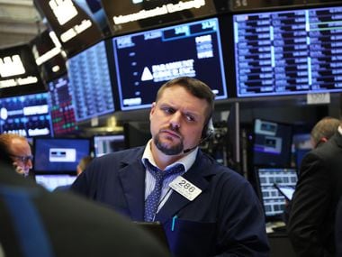     Traders work on the floor of the New York Stock Exchange on March 25th.