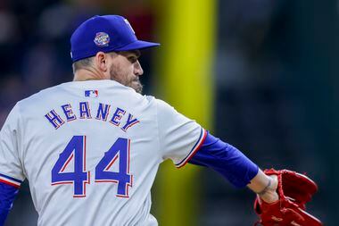 Texas Rangers pitcher Andrew Heaney delivers during the first inning of a baseball game...