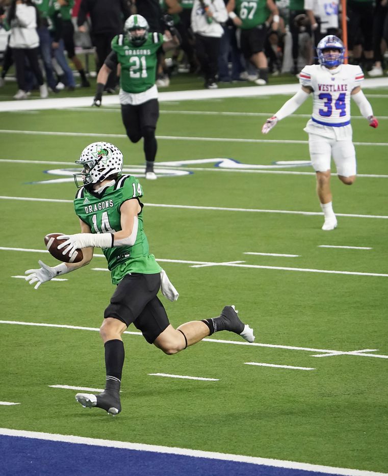 Southlake Carroll wide receiver Brady Boyd (14) scores on a 49-yard touchdown play during the first quarter of the Class 6A Division I state football championship game against Austin Westlake at AT&T Stadium on Saturday, Jan. 16, 2021, in Arlington, Texas. (Smiley N. Pool/The Dallas Morning News)