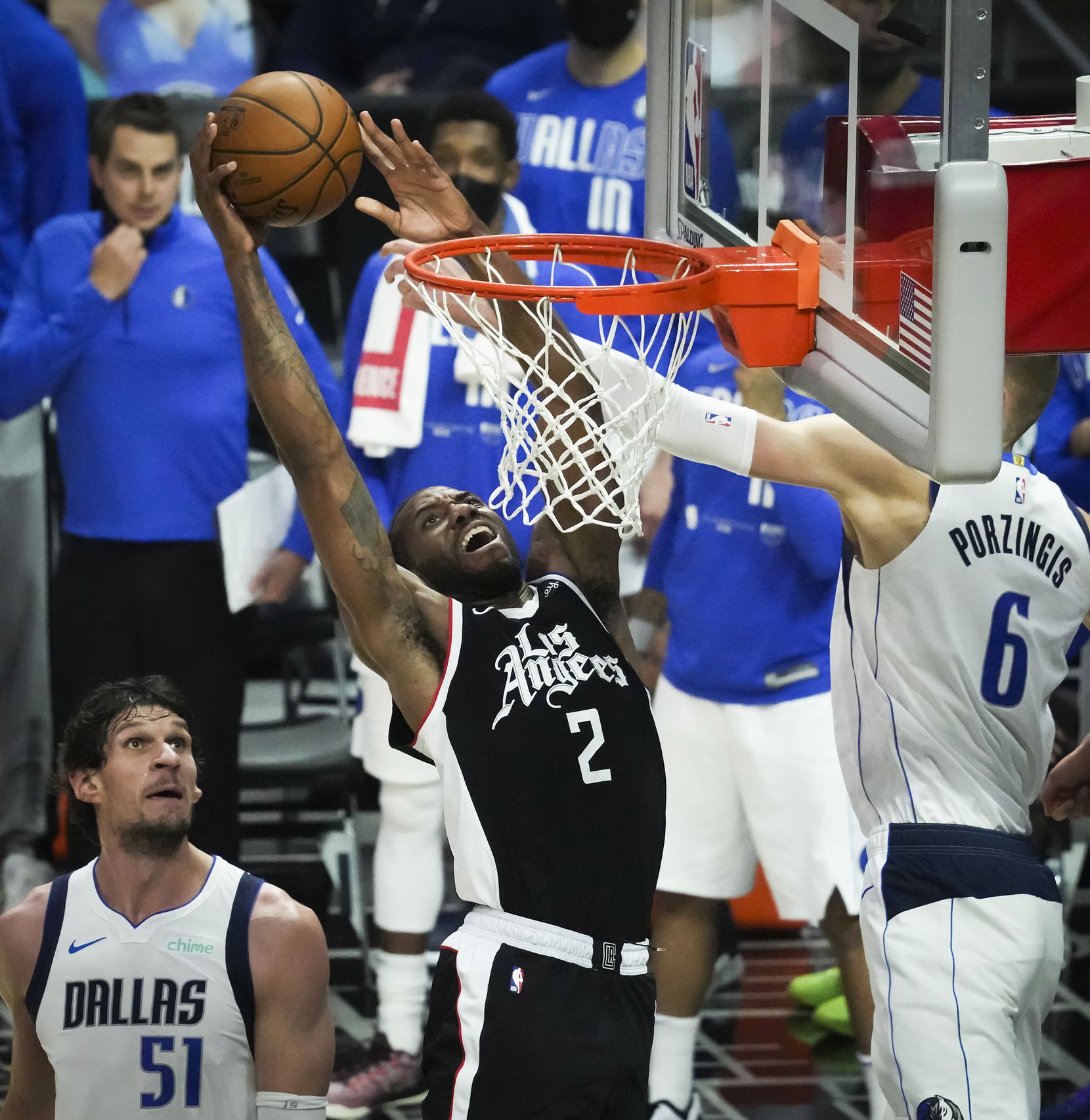 LA Clippers forward Kawhi Leonard (2) dunks the ball past Dallas Mavericks center Kristaps...