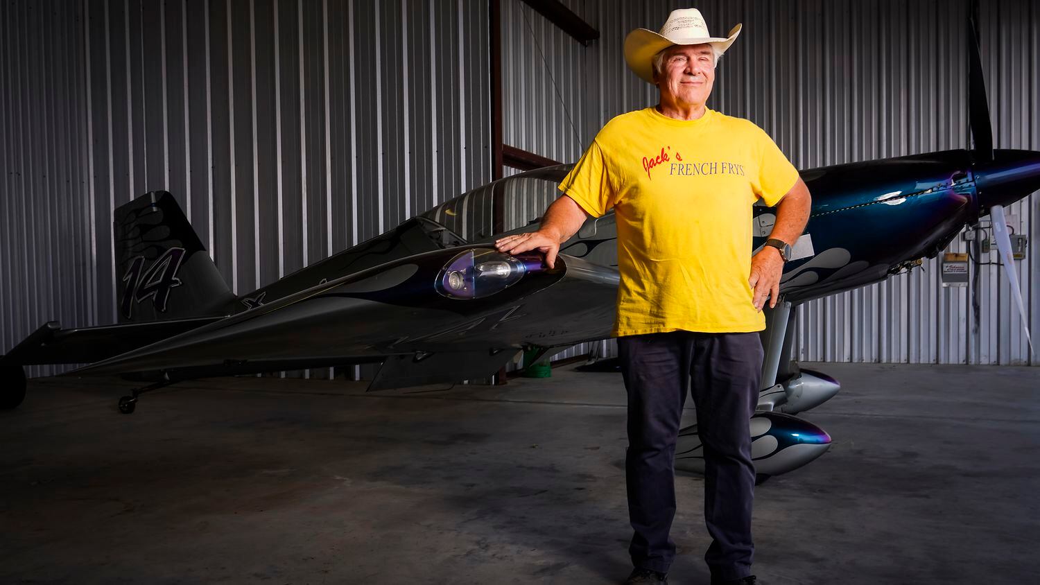 Jack Pyland is photographed with one of his aircraft in a hangar at Lancaster Regional...