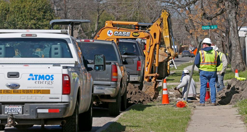 Construction crews work on gas lines on El Centro Drive in Dallas earlier this month.