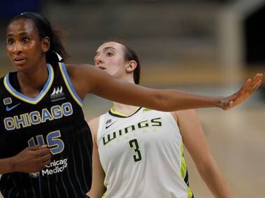 Dallas Wings guard Marina Mabrey (3) watches over the shoulder of Chicago Sky center Astou...