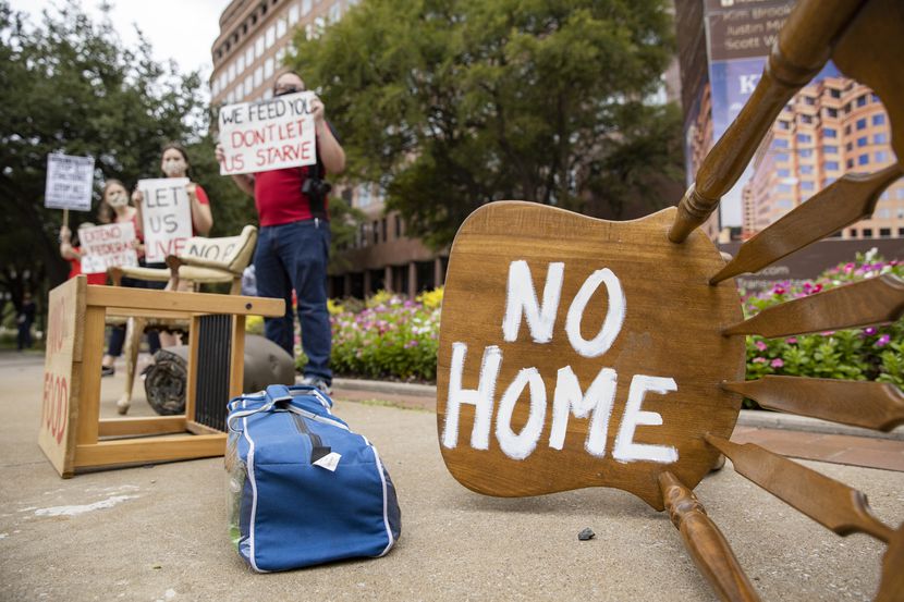 Protesters place furniture and rally outside the Dallas office of Sen. John Cornyn "to show...