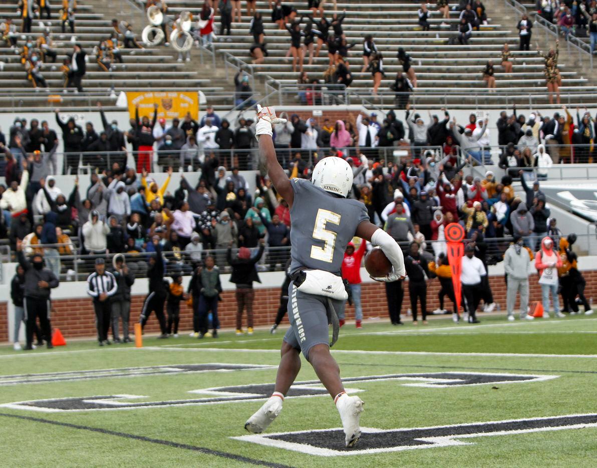 South Oak Cliff receiver Randy Reece (5) ignites Golden Bears fans after his receiving game winning touchdown during the 4th quarter of play against Aledo. South Oak Cliff won 33-28 to advance. The two teams played their Class 5A Division ll Region ll semifinal football game at Vernon Newsom Stadium in Mansfield on November 26, 2021. (Steve Hamm/ Special Contributor)