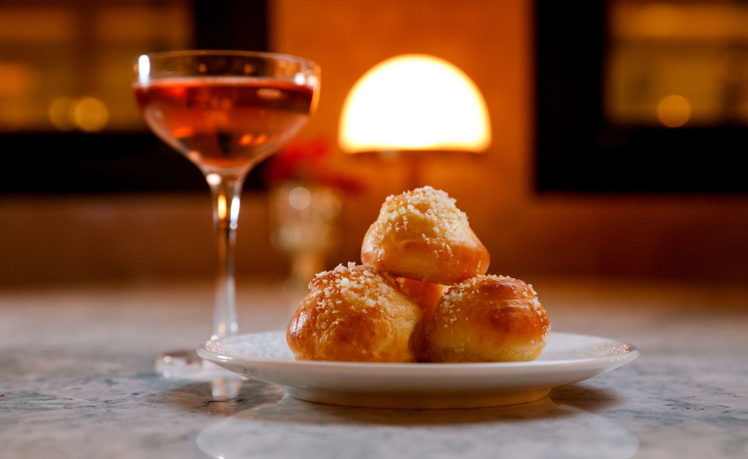 A serving of Gruyere Gougères is paired with a tasting of Perrier-Jouët Rose at champagne...