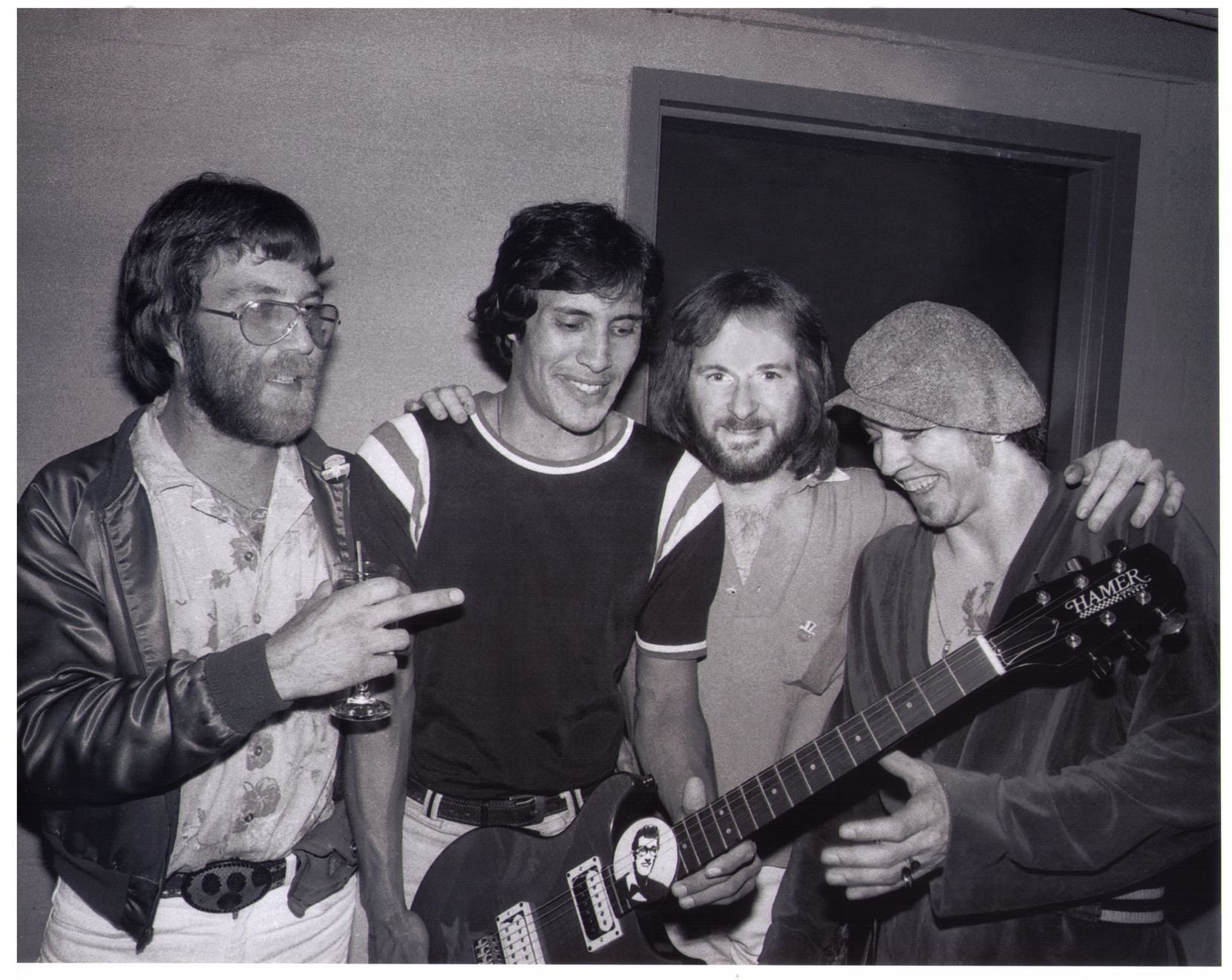     From left to right: Paul Matson (Buddy stafffer), Roy Mora (contest winner), David Williams (also of Buddy) and Stevie Ray Vaughan. (Photo by Kirby Warnock)