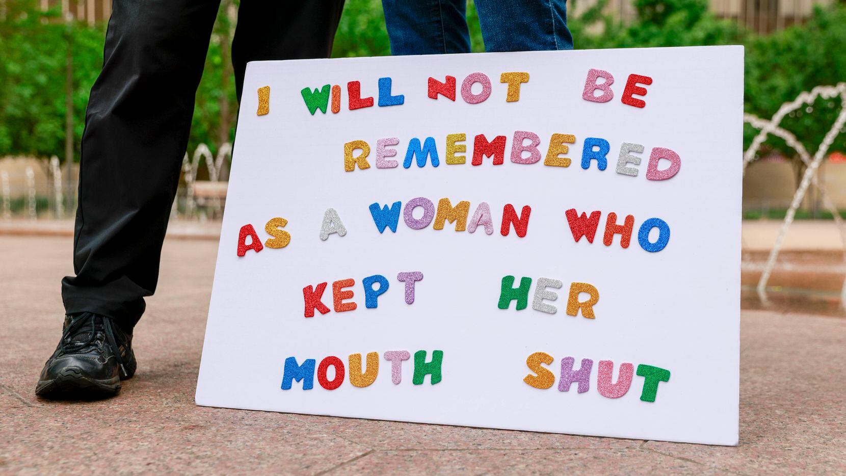 A sign rested on the ground during a rally in support of abortion rights at Civic Garden...