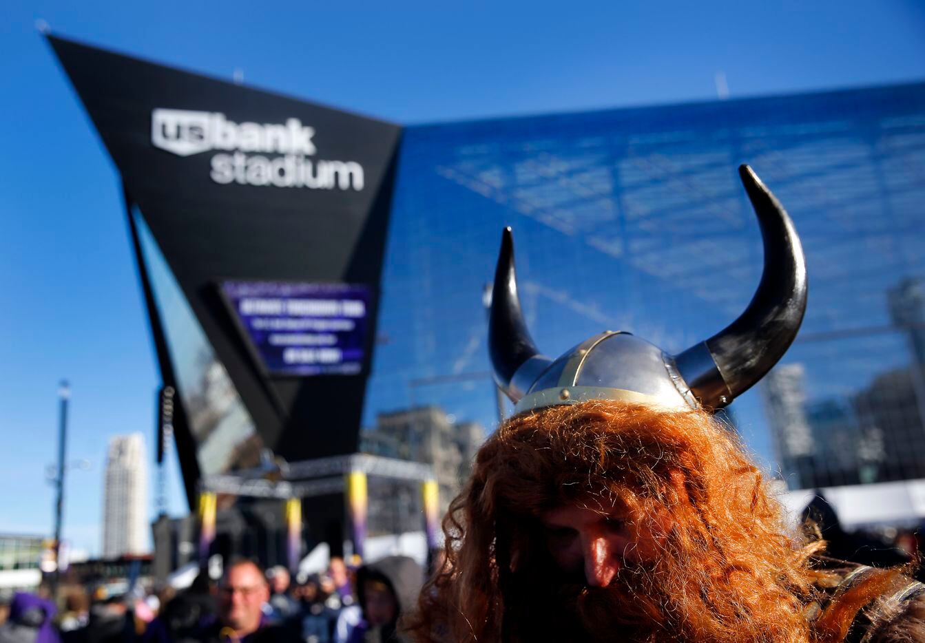 A Minnesota Vikings fan dressed the part as he waited outside U.S. Bank Stadium in...