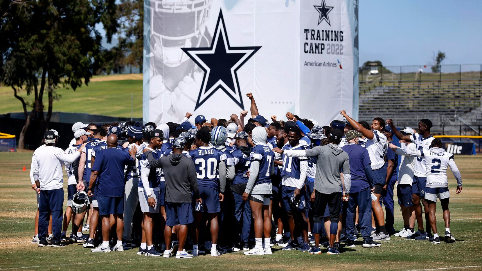 The Dallas Cowboys football team huddles for the final time as they broke training camp...