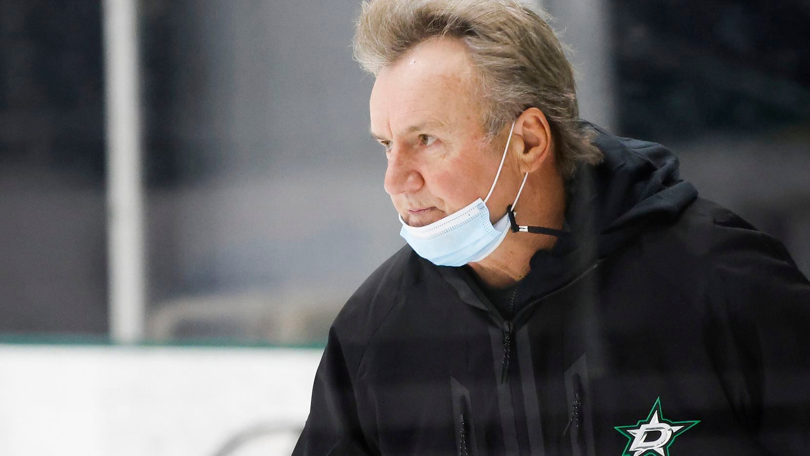 Dallas Stars head coach Rick Bowness watches his team work out during a training camp...
