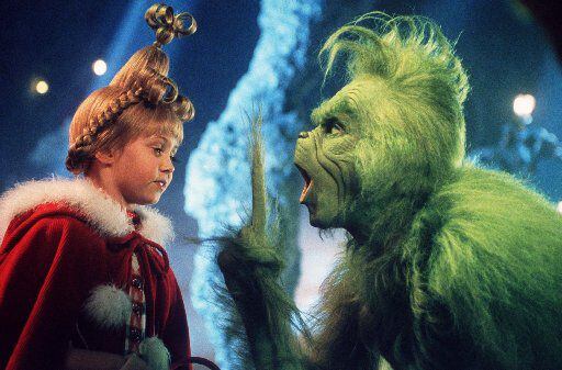 Taylor Momsen as Cindy Lou Who, left, shares a scene with the Grinch, played by Jim Carrey, in 'Dr. Seuss' How The Grinch Stole Christmas.'