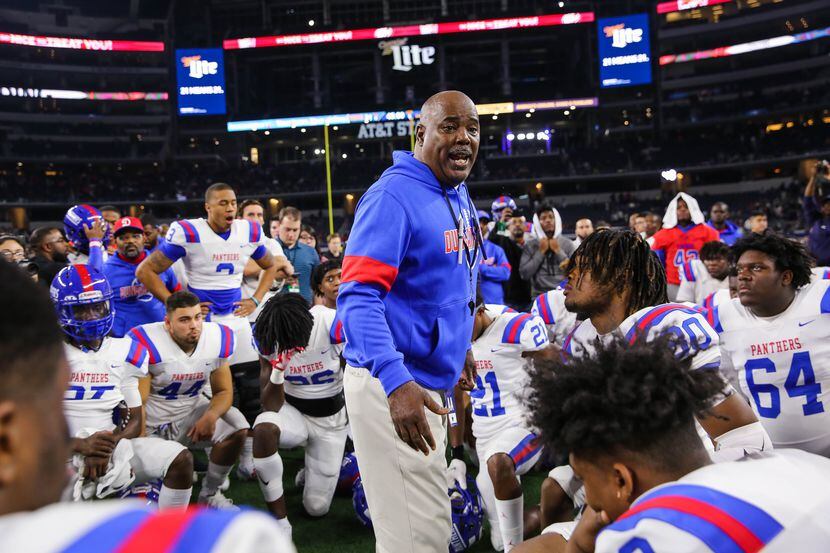 Duncanville's coach Reginald Samples consoles speaks to his team after losing a Class 6A...