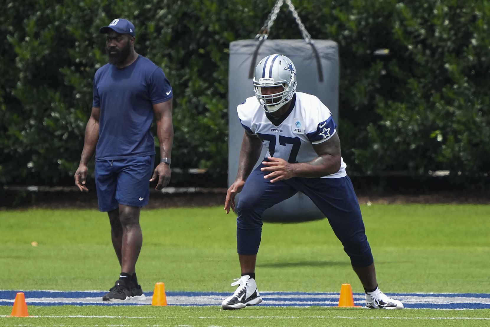 Dallas Cowboys tackle Tyron Smith runs a conditioning drill during a minicamp practice at...