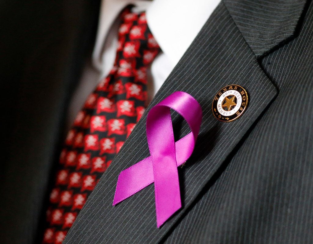 Purple ribbons honoring Linda "Michellita" Rogers, were distributed to members of the Texas...