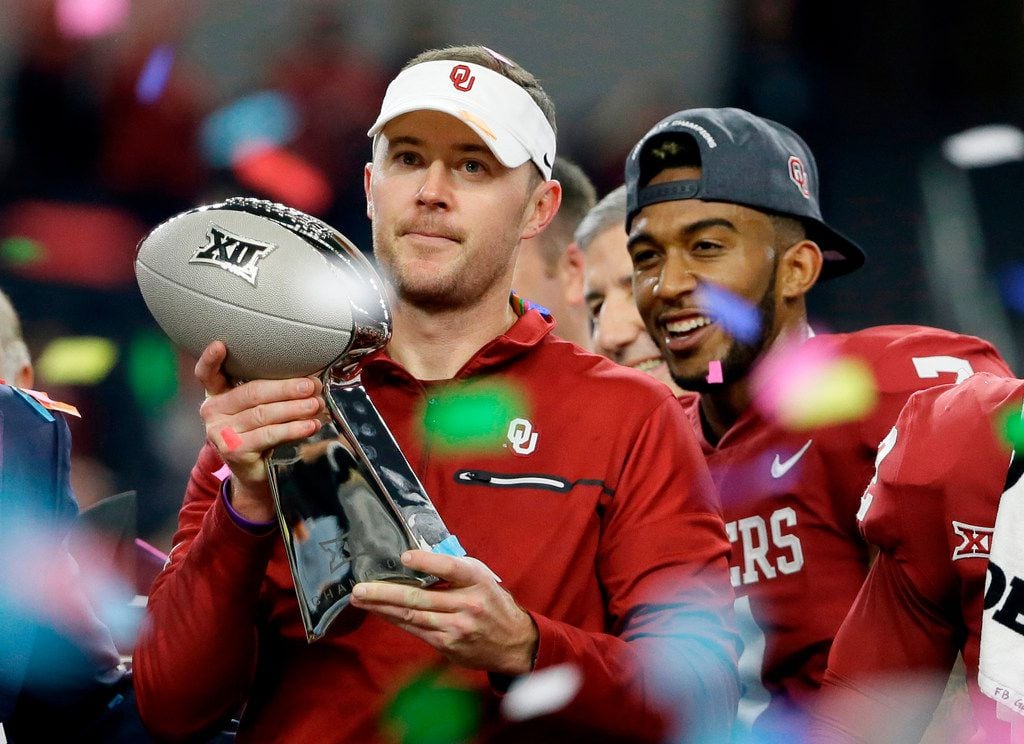 FILE - In this Dec. 2, 2017, file photo, Oklahoma head coach Lincoln Riley holds the Big 12...