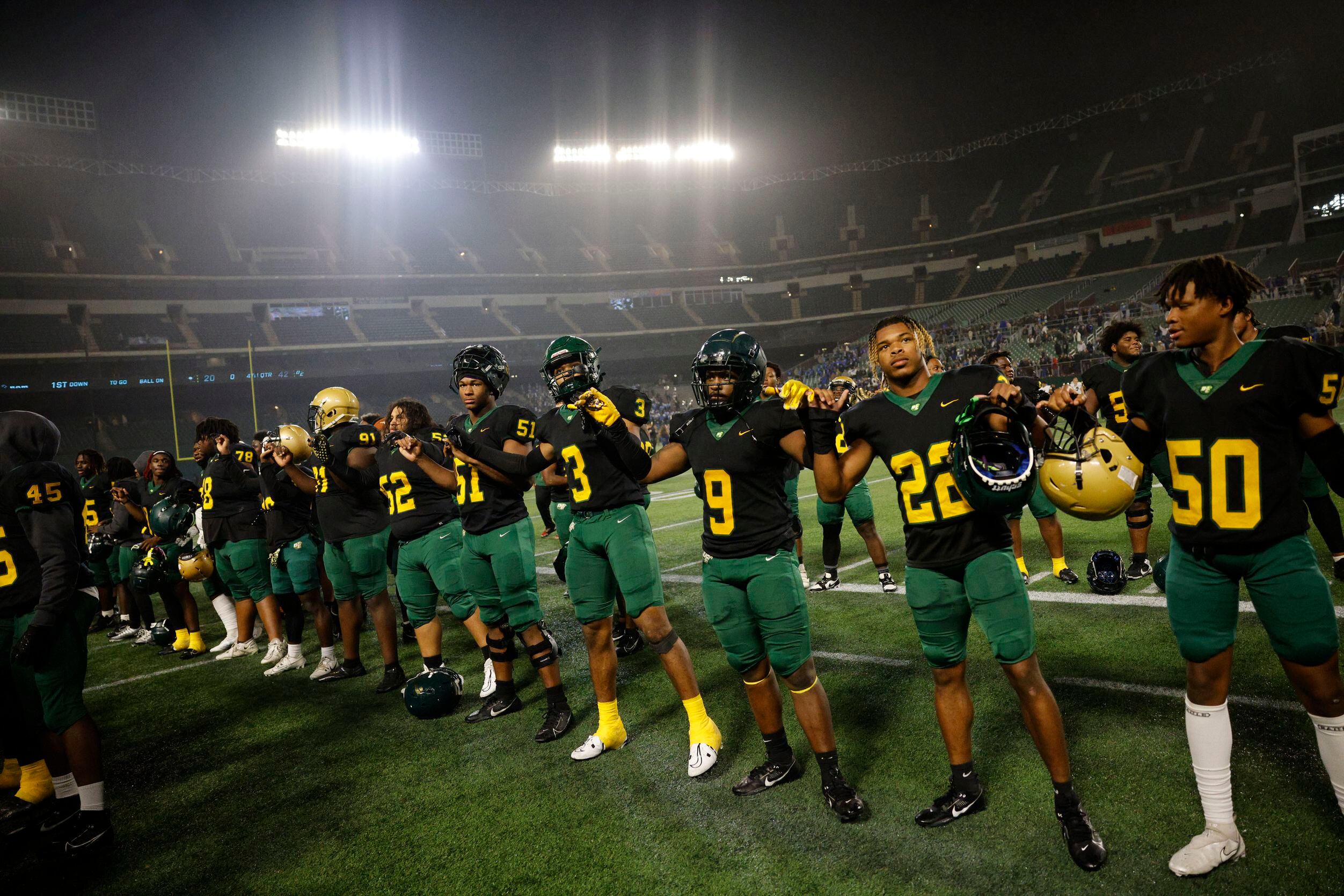 DeSoto players celebrate after their 42-20 victory against Wylie East at a Class 6A Division...
