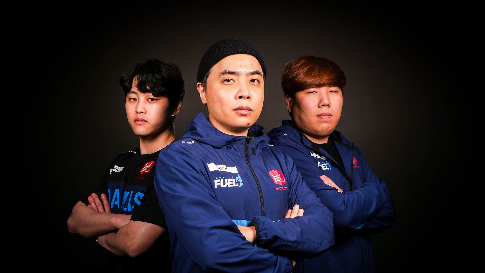 Dallas Fuel head coach Yun "RUSH" Hee-Won (center) photographed with assistant coaches Kim...