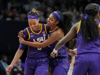 LSU forward Angel Reese (10) celebrates with forward LaDazhia Williams (0) during the second...