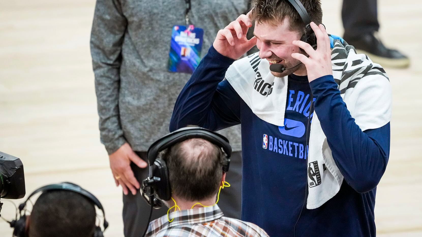 Dallas Mavericks guard Luka Doncic smiles as he does a broadcast interview after a victory...