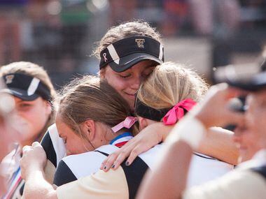 The Colony's Jayda Coleman, center, embraces teammates after the medal ceremony during the...