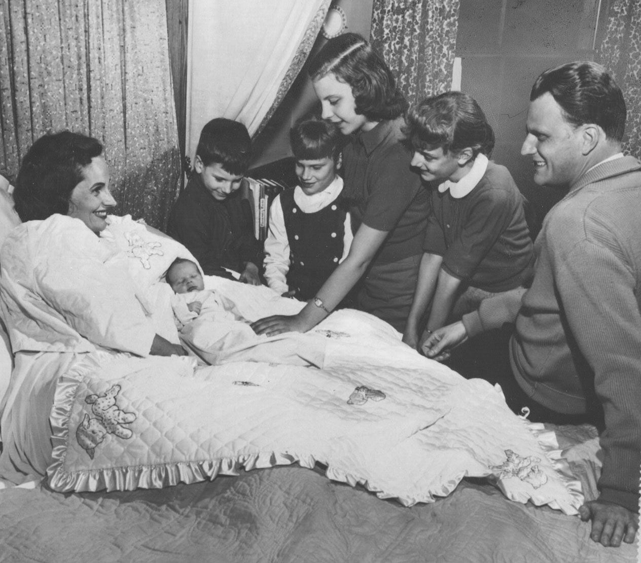 Rev. Billy Graham says goodbye to wife Ruth Graham and their five children in 1958. He was...