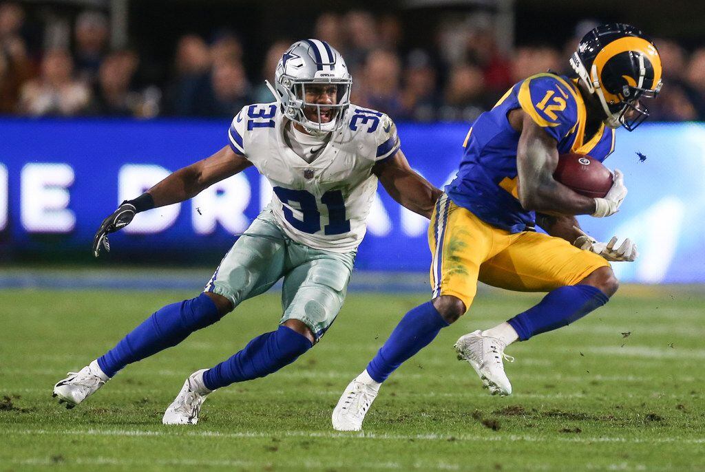 Dallas Cowboys cornerback Byron Jones (31) works to stop Los Angeles Rams wide receiver...