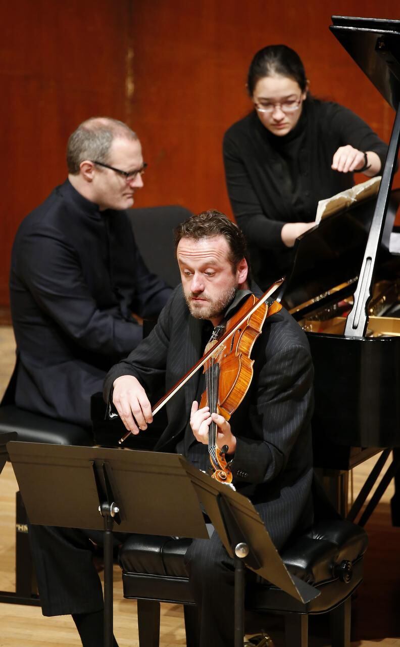 
Benjamin Rivinius (front) and Dirk Mommertz (top left) performed onstage with the Fauré...