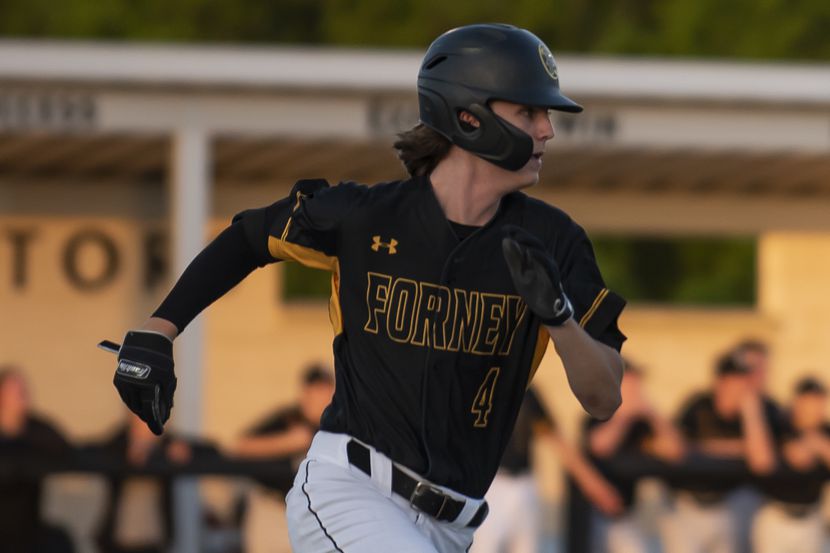 Forney pitcher Aiden Sims (4) sprints after drilling a double to deep center field during a...