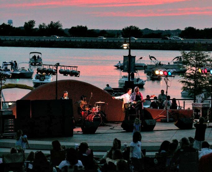 A band plays as the sun sets at the Concerts by the Lake at The Harbor in Rockwall.