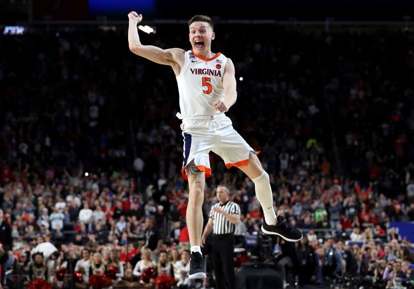 Kyle Guy of the Virginia Cavaliers celebrate his teams 85-77 win over the Texas Tech Red...