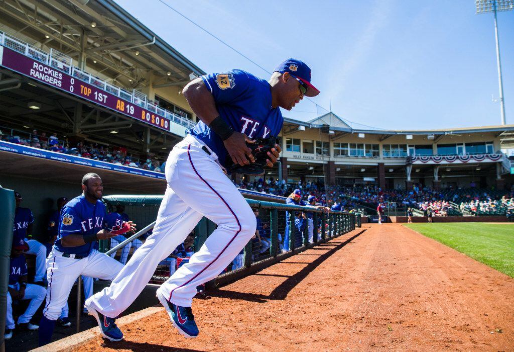 Texas Rangers third baseman Adrian Beltre (29) runs on to the field before a spring training...