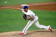 Texas Rangers relief pitcher Jonathan Hernandez (72) throws against the Oakland Athletics...