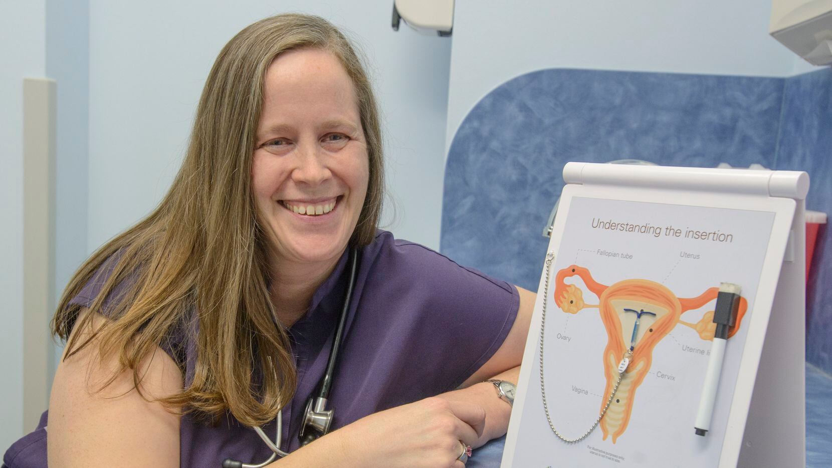 Pediatric OB/GYN Dr. Shanna Combs with a diagram describing how an IUD is inserted in one of...