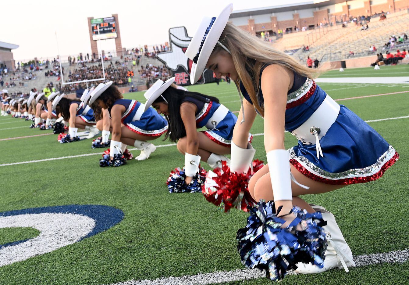 Maleah Front, sophomore, performs with the Allen Talonettes in the first half of a high...