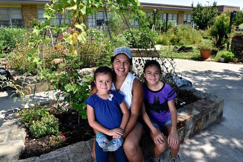 Parent and volunteer Maria Amaya, 36, with her daughters  Sophia Terry, 6, and Sarah Terry,...