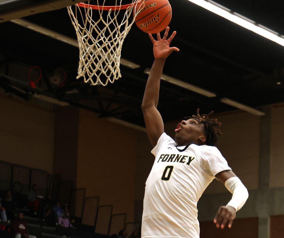 Forney forward Ronnie Harrison (0) skies to pull down a defensive rebound off the rim during...