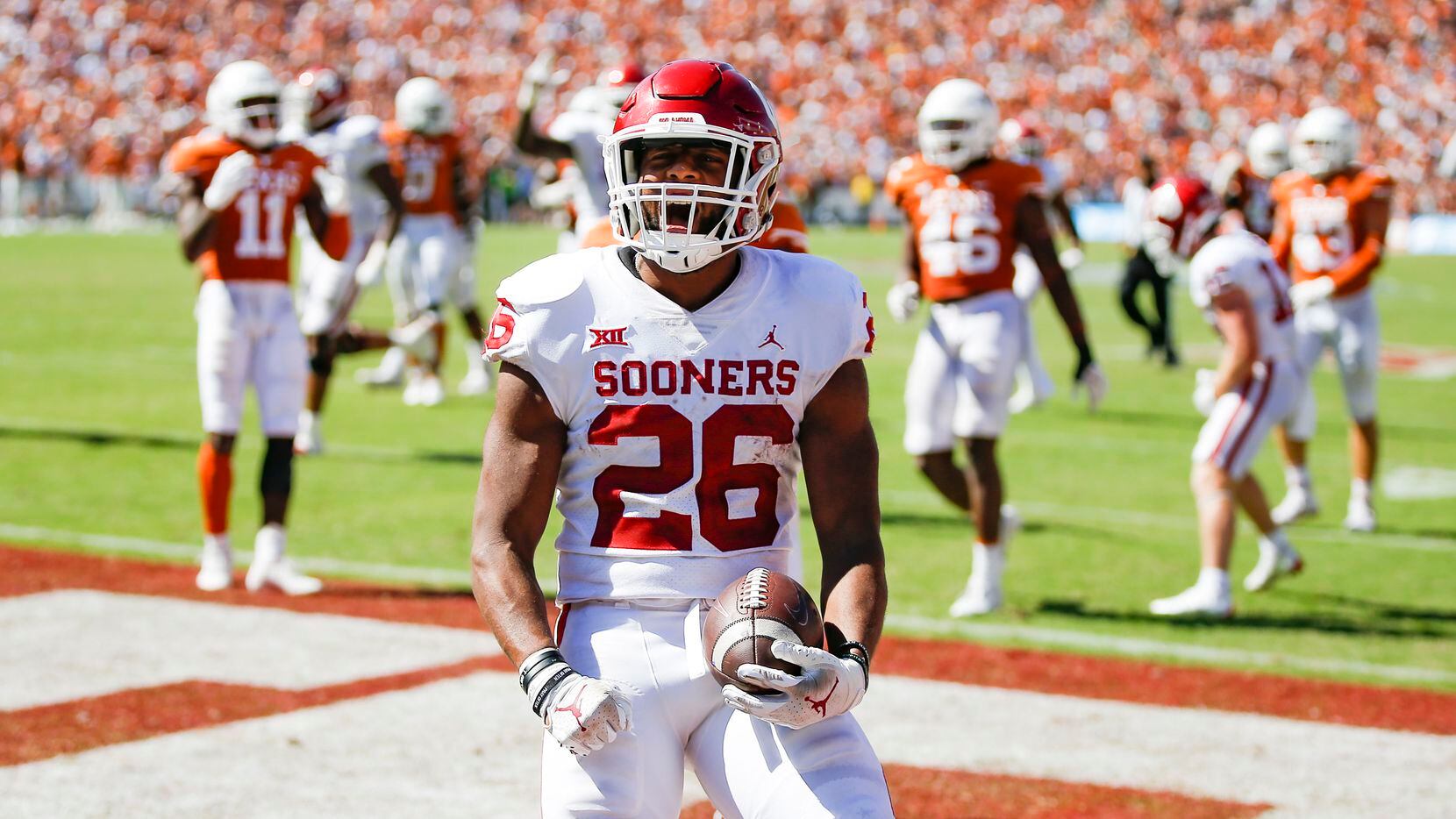 Oklahoma running back Kennedy Brooks (26) scores a touchdown during the second half of an...