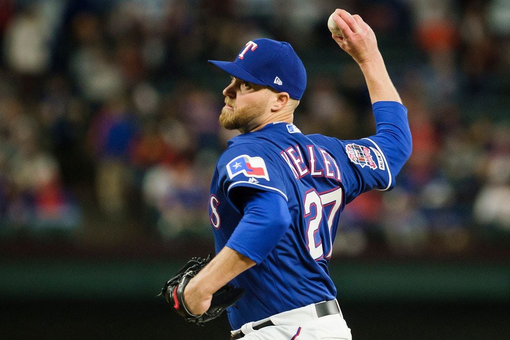 Texas Rangers pitcher Shawn Kelley throws during the eighth inning against the Houston...