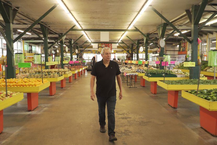 Food writer and chef Adán Medrano shops at Houston's Airline Farmers Market in the opening...