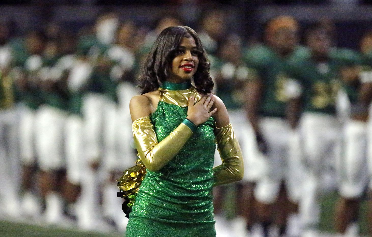 DeSoto Eaglette Kandace White stands at attention for the national anthem before kickoff as DeSoto High School played Duncanville High School in the Class 6A Division I Region II final playoff game at the Ford Center in Frisco on Saturday, December 4, 2021. (Stewart F. House/Special Contributor)