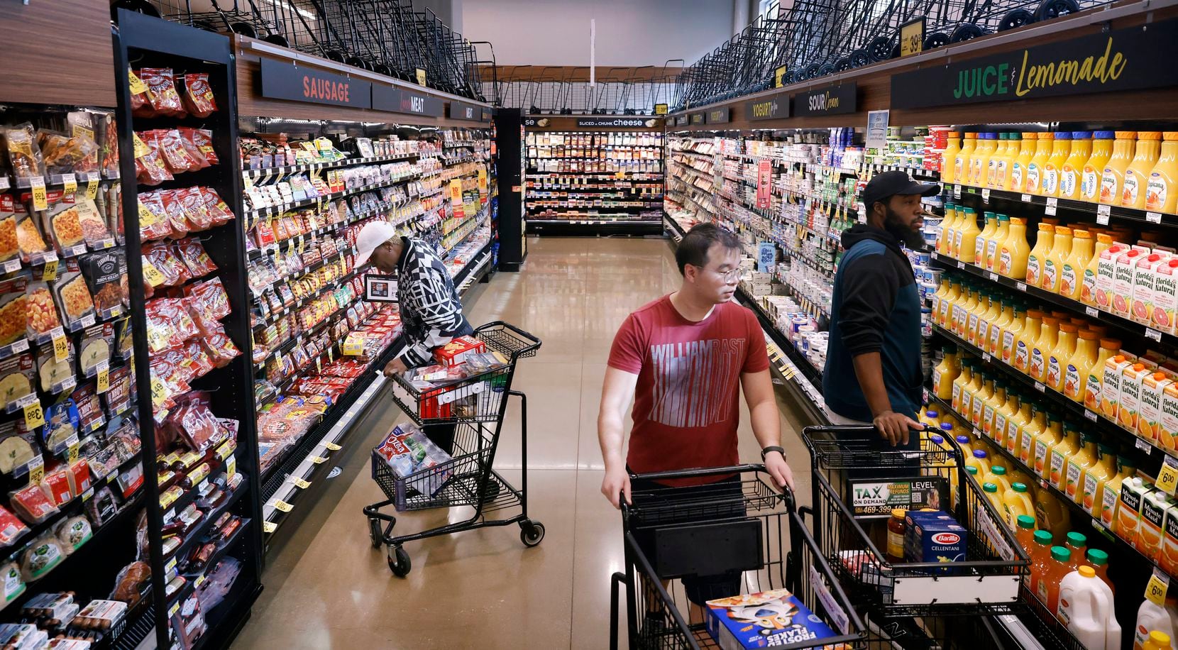 Shoppers peruse the aisles of the Tom Thumb grocery store on Live Oak Street just east of...