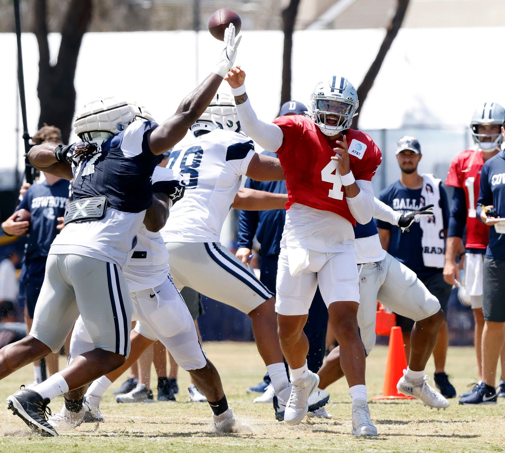 Dallas Cowboys quarterback Dak Prescott (4) throws downfield as the defense collapses around...