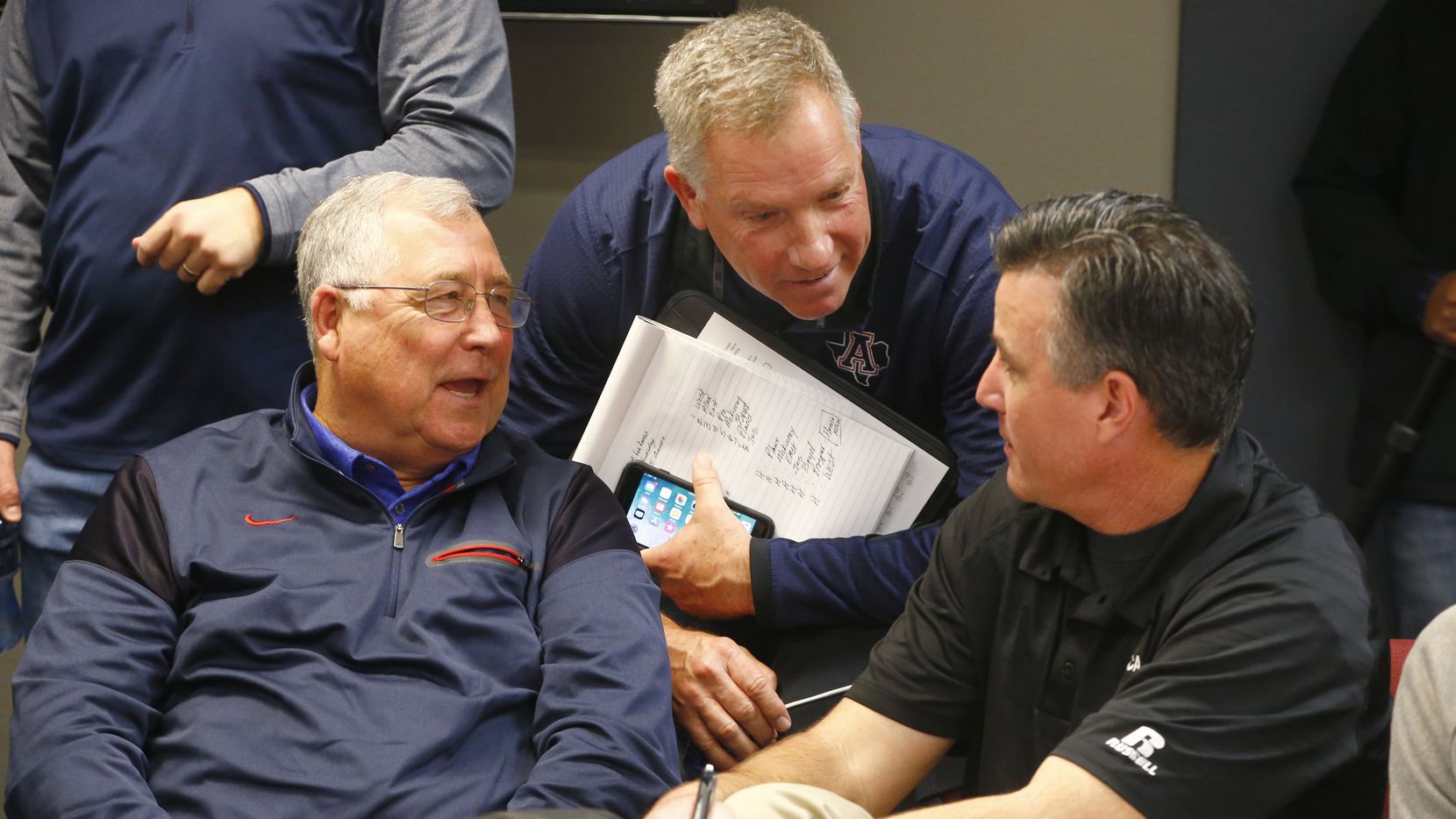 Allen's Steve Williams (from left) talks with head football coach Terry Gambill with Plano's...